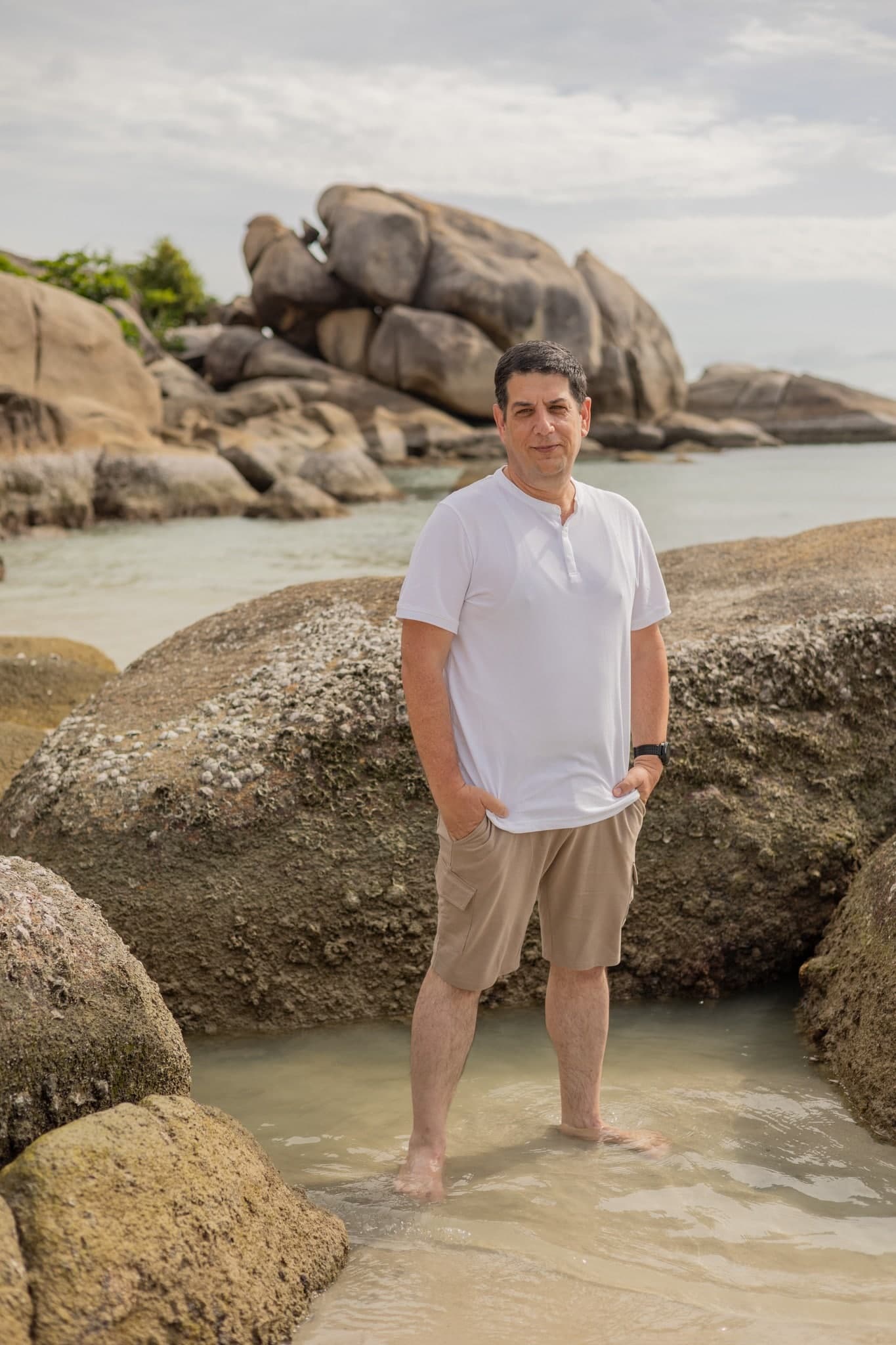Shay Eisenberg standing by the shore